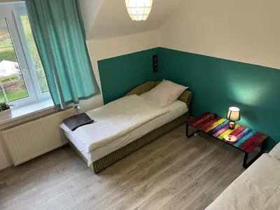 Łóżko lub łóżka w pokoju w obiekcie Zajazd Magrani