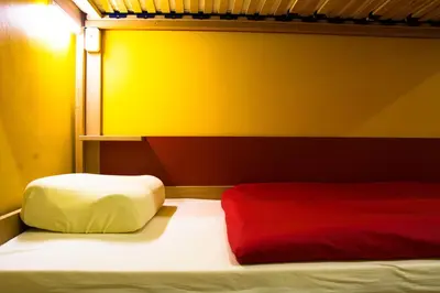 Łóżko lub łóżka w pokoju w obiekcie Event Hostel - Opole