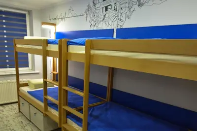 Łóżko lub łóżka w pokoju w obiekcie Event Hostel - Opole