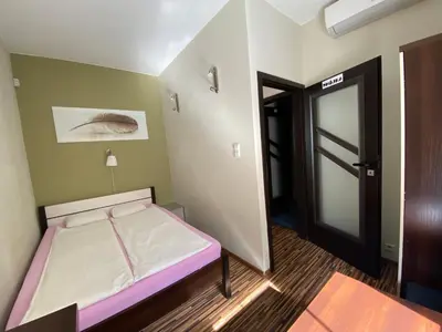 Łóżko lub łóżka w pokoju w obiekcie Event Hostel - Opole