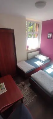 Łóżko lub łóżka w pokoju w obiekcie Gospoda w Starym Młynie