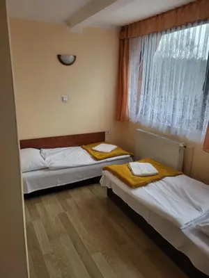 Łóżko lub łóżka w pokoju w obiekcie O.W.S. Strzecha