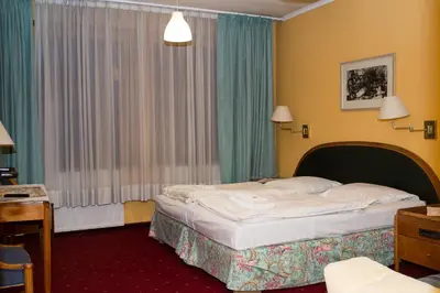 Łóżko lub łóżka w pokoju w obiekcie Hotel Karkonosze
