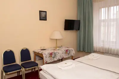 Łóżko lub łóżka w pokoju w obiekcie Hotel Karkonosze