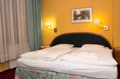 Łóżko lub łóżka w pokoju w obiekcie Hotel Karkonosze