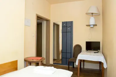 Łóżko lub łóżka w pokoju w obiekcie Hotel Karkonosze