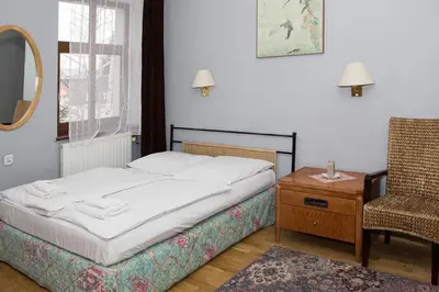 Łóżko lub łóżka w pokoju w obiekcie Hotel Karkonosze