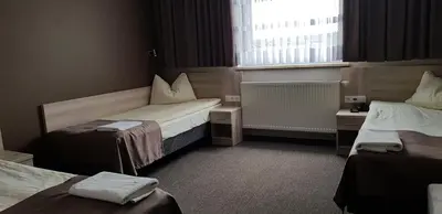 Łóżko lub łóżka w pokoju w obiekcie Zajazd Tytan