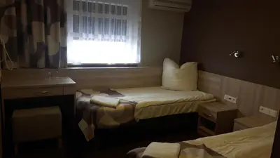 Łóżko lub łóżka w pokoju w obiekcie Zajazd Tytan
