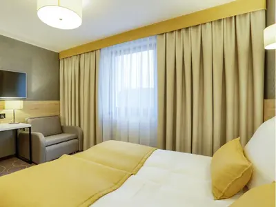 Łóżko lub łóżka w pokoju w obiekcie Hotel Antek