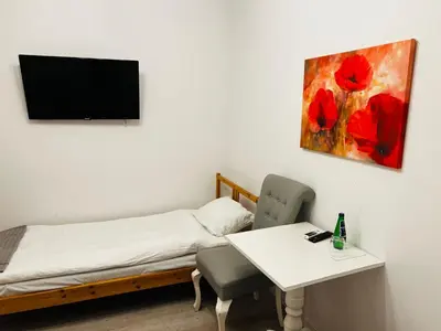 Łóżko lub łóżka w pokoju w obiekcie Piławski Dwór