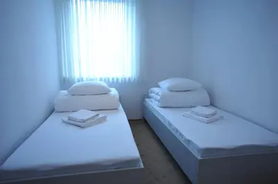 Łóżko lub łóżka w pokoju w obiekcie Apartament Tais