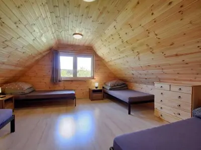 Łóżko lub łóżka w pokoju w obiekcie Apartamenty Wiktora
