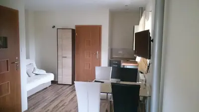 Łóżko lub łóżka w pokoju w obiekcie Apartamenty Wiktora
