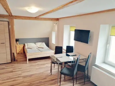 Łóżko lub łóżka w pokoju w obiekcie Apartamenty Wiktora