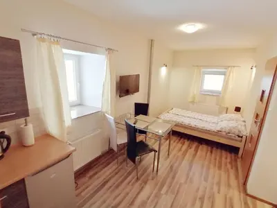 Łóżko lub łóżka w pokoju w obiekcie Apartamenty Wiktora