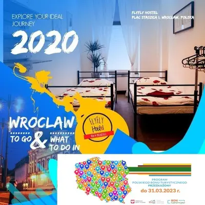Łóżko lub łóżka w pokoju w obiekcie FlyFly Hostel , darmowy parking , rezerwuj przez urządzenia mobilne -10 procent