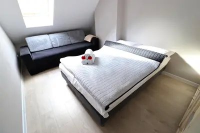 Łóżko lub łóżka w pokoju w obiekcie Apartamenty BM'Kruk