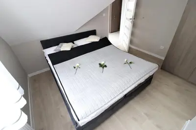 Łóżko lub łóżka w pokoju w obiekcie Apartamenty BM'Kruk