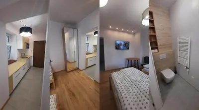 Telewizja i/lub zestaw kina domowego w obiekcie Kościuszki 3 Apartamenty