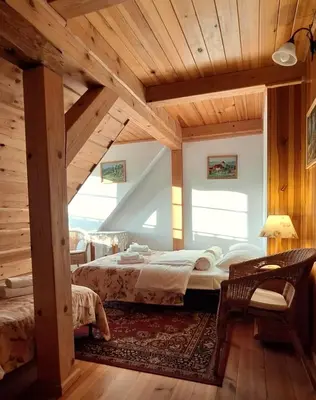 Łóżko lub łóżka w pokoju w obiekcie Gospodarstwo Gościnne Jesionówka