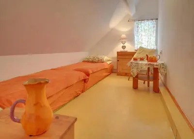 Łóżko lub łóżka w pokoju w obiekcie Biotanika
