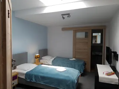 Łóżko lub łóżka w pokoju w obiekcie Es8bar
