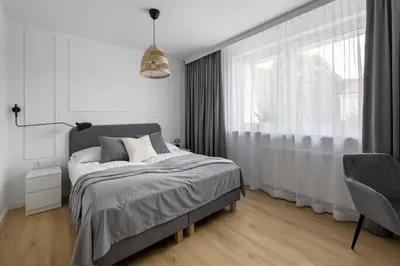 Łóżko lub łóżka w pokoju w obiekcie Apartamenty Rodzinne Zdrojowe