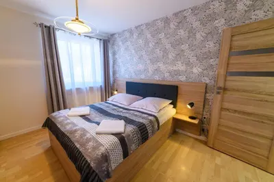 Łóżko lub łóżka w pokoju w obiekcie Apartamenty Rodzinne Zdrojowe