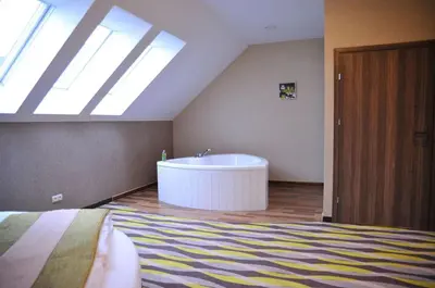 Łóżko lub łóżka w pokoju w obiekcie Oswald Arena