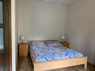 Łóżko lub łóżka w pokoju w obiekcie Apartamenty pokoje 
