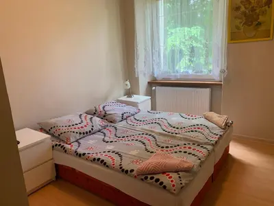 Łóżko lub łóżka w pokoju w obiekcie Apartamenty pokoje 