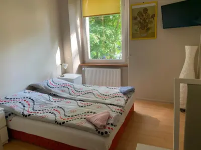 Łóżko lub łóżka w pokoju w obiekcie Apartamenty pokoje 