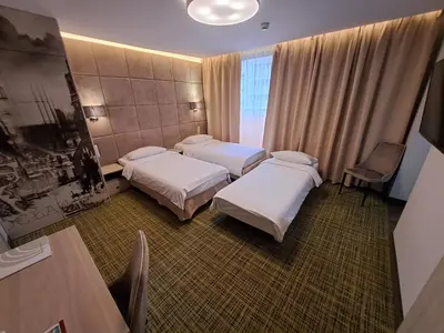 Łóżko lub łóżka w pokoju w obiekcie Citi Hotel's Wrocław