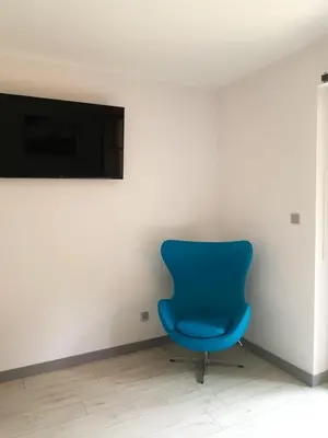 Telewizja i/lub zestaw kina domowego w obiekcie Apartament z Ogrodem