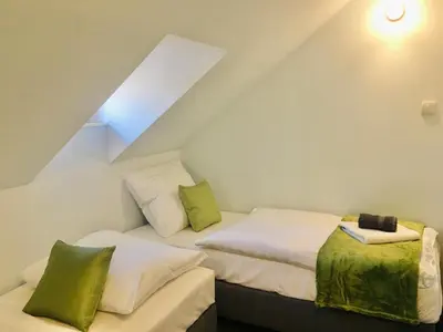 Łóżko lub łóżka w pokoju w obiekcie Gościniec Kowalova