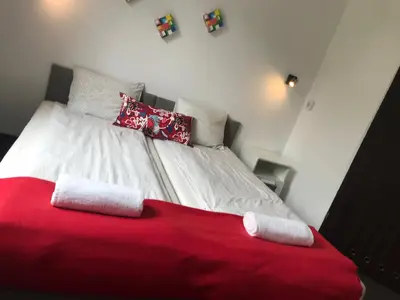 Łóżko lub łóżka w pokoju w obiekcie Szekla