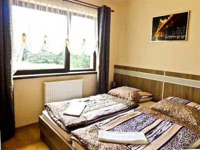 Łóżko lub łóżka w pokoju w obiekcie Zajazd Sielankowe Klimaty