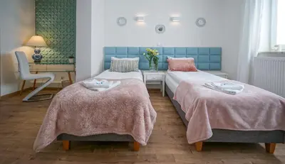 Łóżko lub łóżka w pokoju w obiekcie Happy Day Apartments