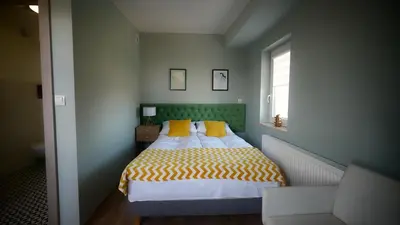 Łóżko lub łóżka w pokoju w obiekcie Happy Day Apartments