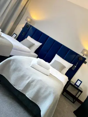 Łóżko lub łóżka w pokoju w obiekcie Hotel 