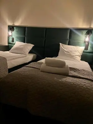 Łóżko lub łóżka w pokoju w obiekcie Hotel 