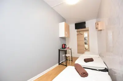 Łóżko lub łóżka w pokoju w obiekcie City Central Hostel - Pokoje prywatne