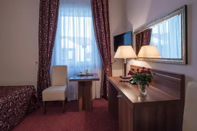 Łóżko lub łóżka w pokoju w obiekcie Jasek Premium Hotel Wrocław