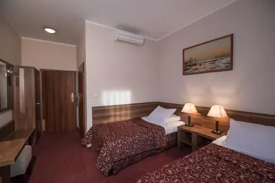 Łóżko lub łóżka w pokoju w obiekcie Jasek Premium Hotel Wrocław