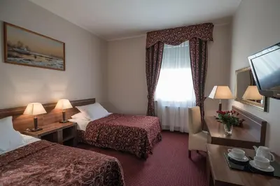Łóżko lub łóżka w pokoju w obiekcie Jasek Premium Hotel Wrocław