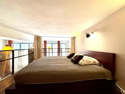 Łóżko lub łóżka w pokoju w obiekcie LoftApart