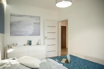 Łóżko lub łóżka w pokoju w obiekcie Apartamenty City View od WroclawApartament-pl