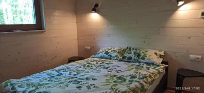 Łóżko lub łóżka w pokoju w obiekcie Dom na Końcu Świata