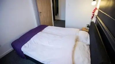 Łóżko lub łóżka w pokoju w obiekcie Hotel Granada